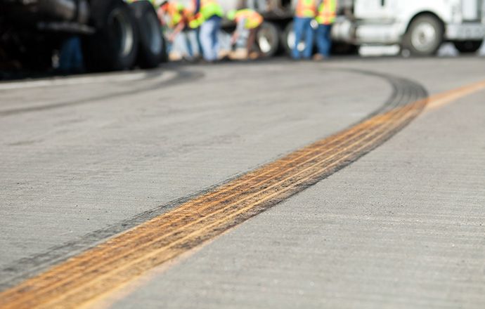 A road with tire marks on it.